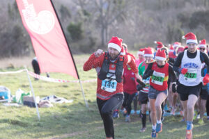 Runners in festive attire get underway at the 3rd annual Lewes Downland Santa Run